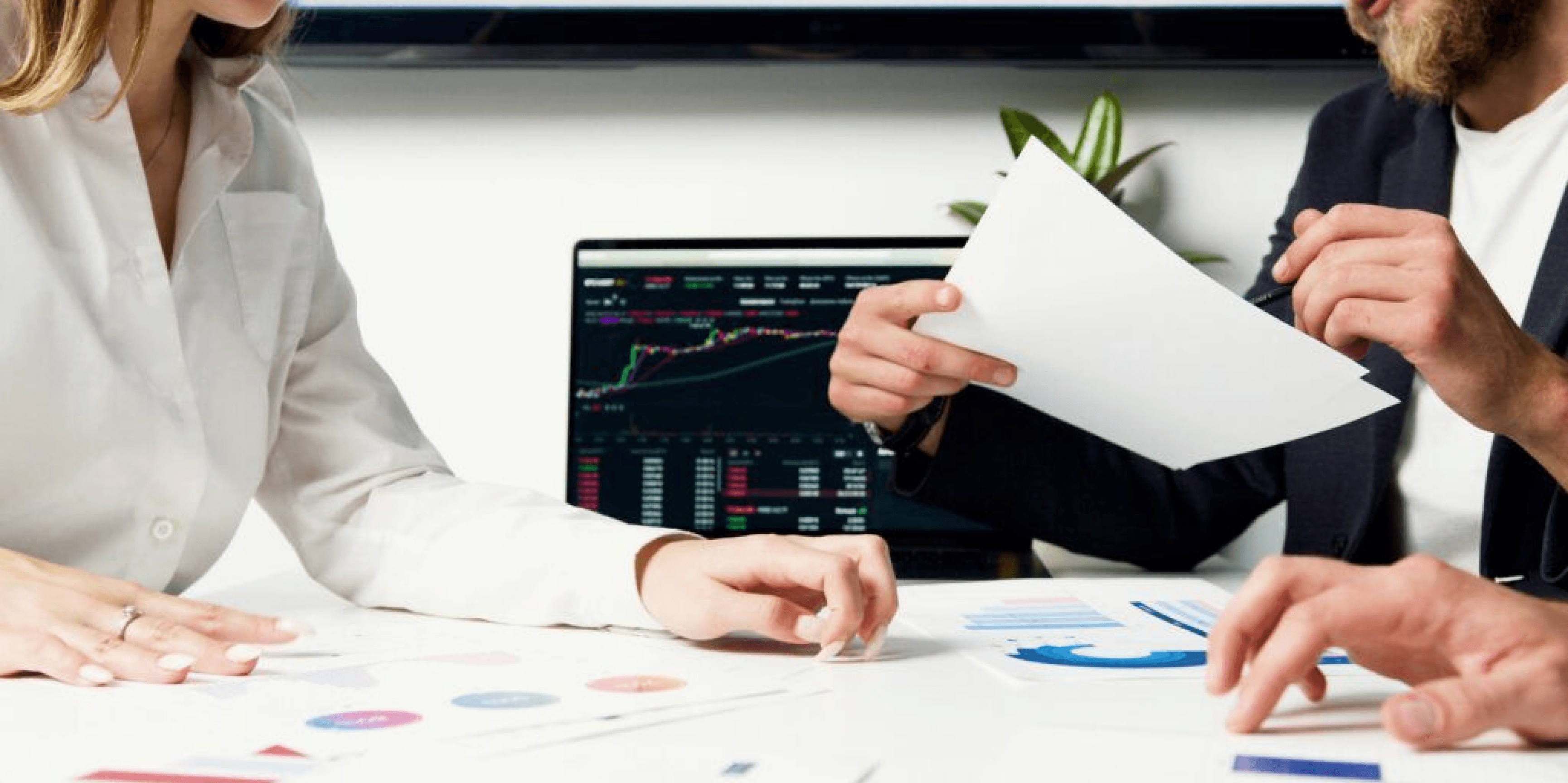 Two persons analysing data.